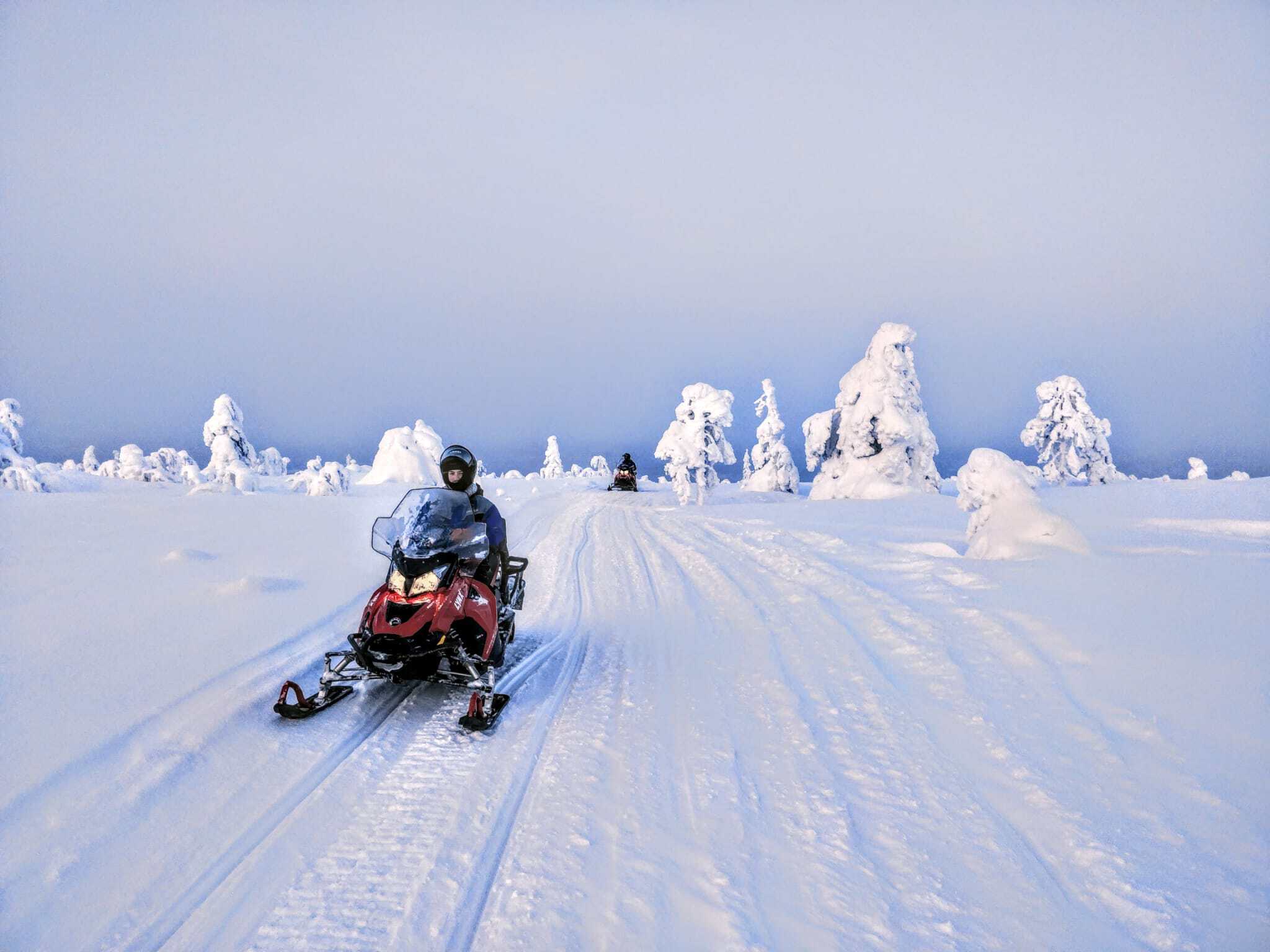 Snowmobile safari on a snowy trail